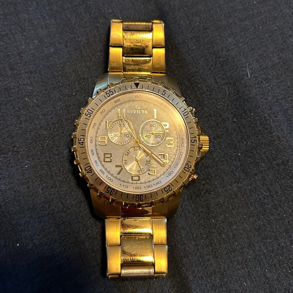 Gold Invicta watch